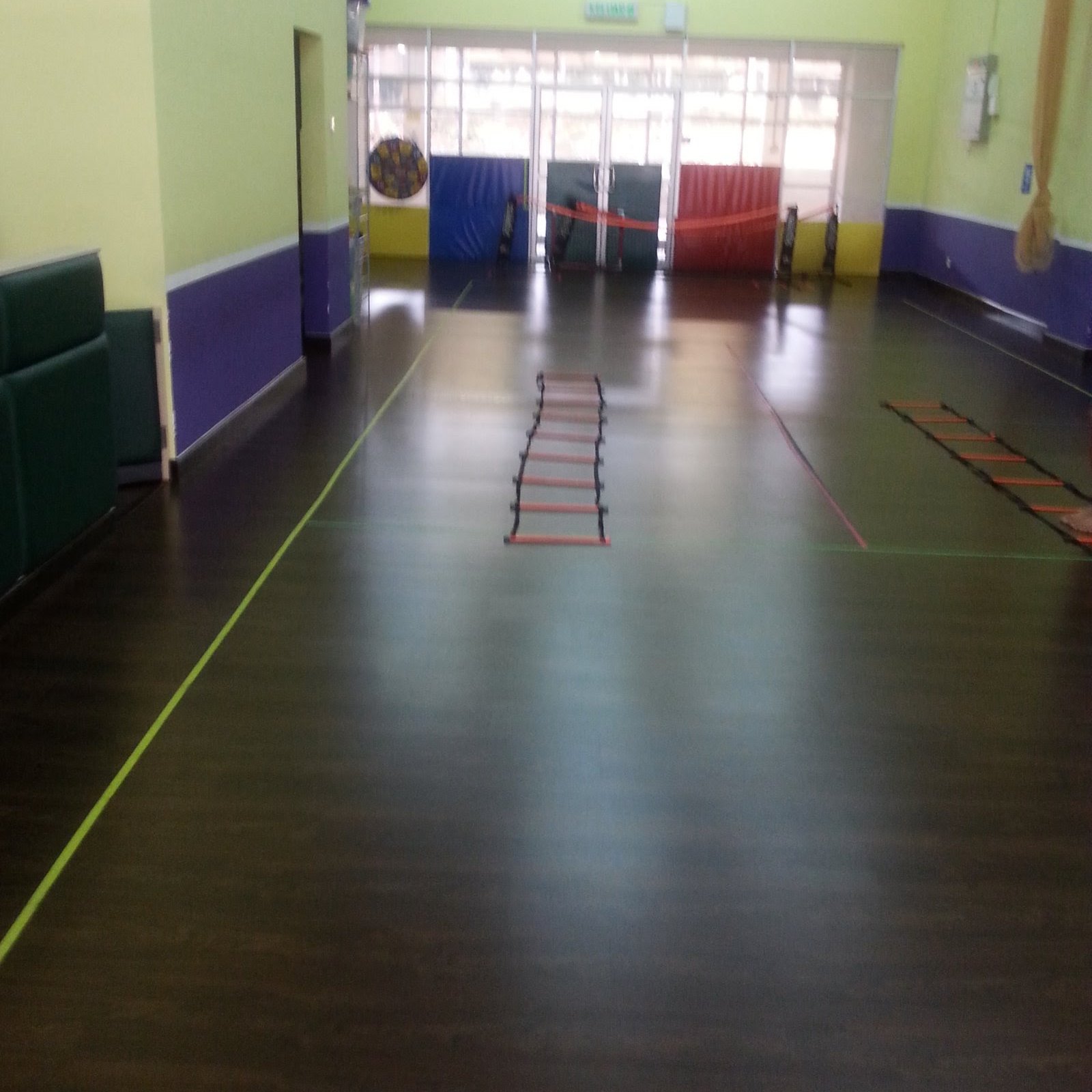 The Monster Tennis indoor studio at Solaris Dutamas with agility ladders and padded walls